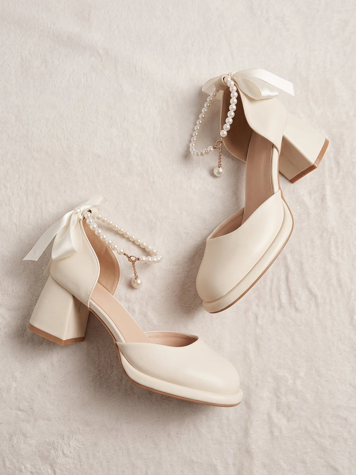 Ottavienne Pearl Bow Block Heels