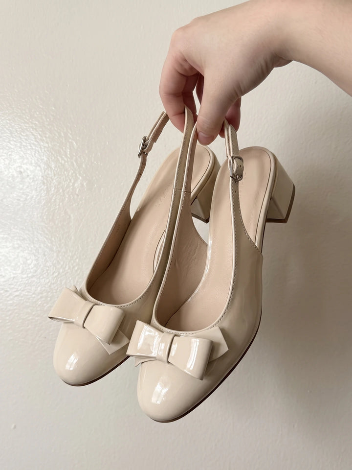 Laurence Cream Patent Bow Heels