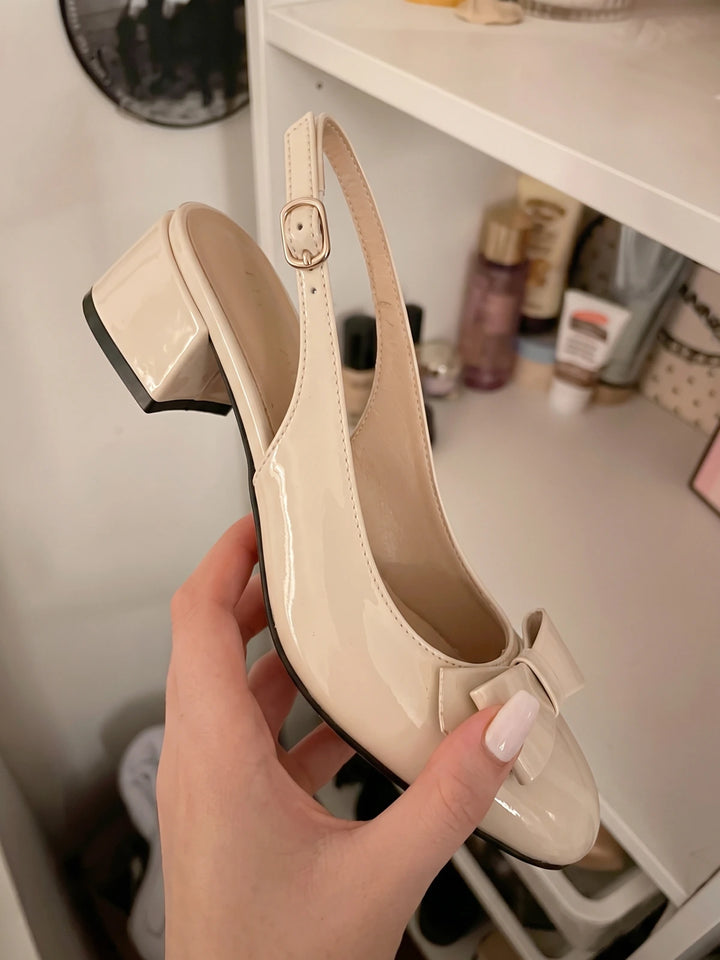 Laurence Cream Patent Bow Heels