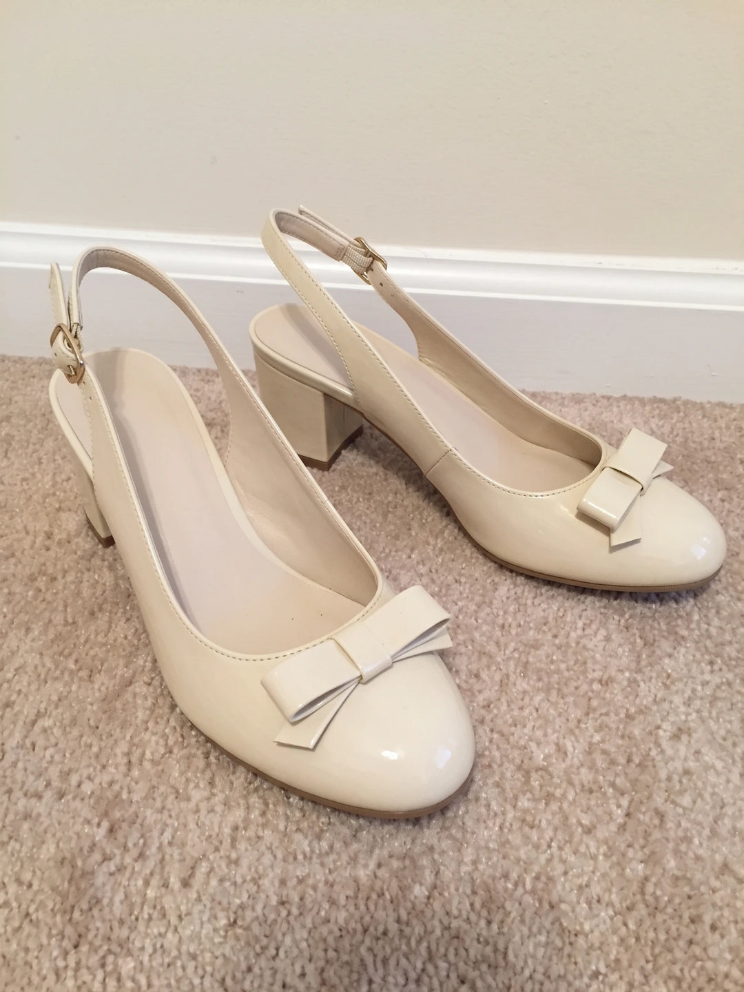 Laurence Cream Patent Bow Heels