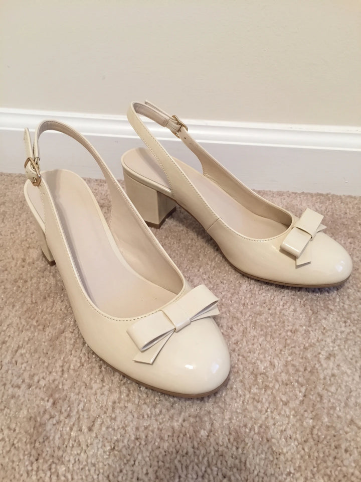 Laurence Cream Patent Bow Heels
