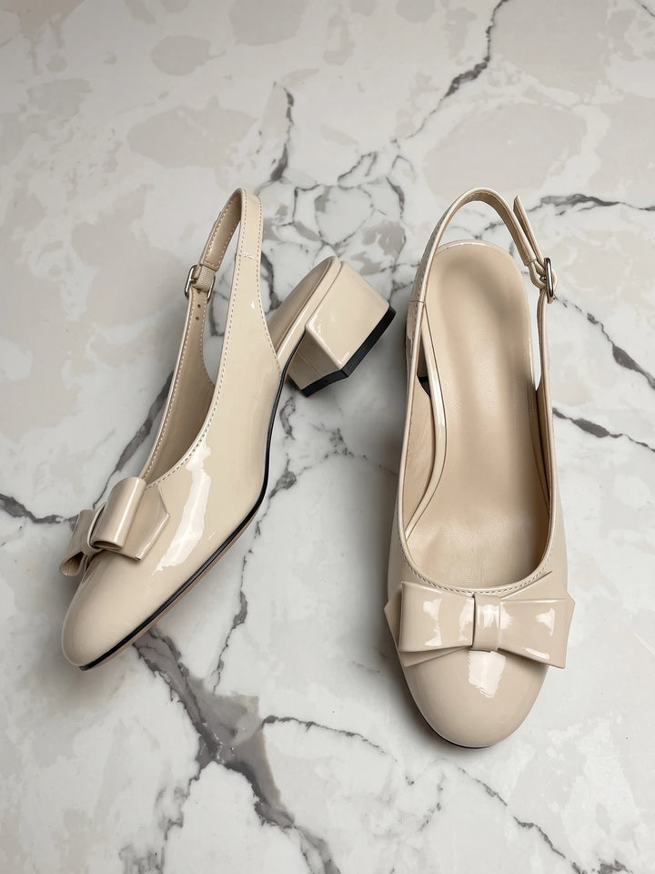 Laurence Cream Patent Bow Heels